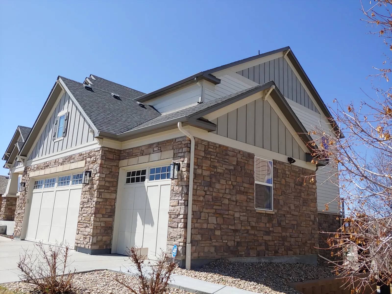 house-with-stone-exterior-and-attached-garage