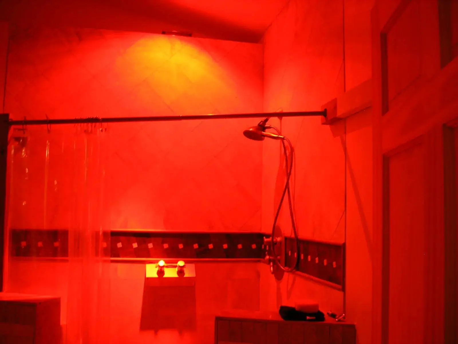 dramatic-red-lit-bathroom-with-shower dramatic-red-lit-bathroom-with-shower